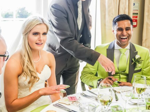 Bride and groom amazed by table magic at wedding breakfast